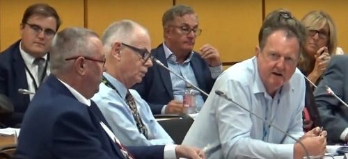 Cllr Steve Foulkes (Lead Member for Finance and Organisational Development) front (right) answering a question at a public meeting of the Transport Committee (Liverpool City Region Combined Authority) 9th August 2018